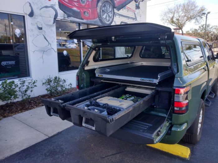 2022 Green Nissan Frontier With Leer 100xr Topperking Topperking Providing All Of Tampa 6381